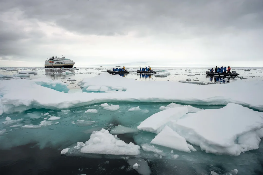 Expedition boat cruising at the Ice Edge, Svalbard. Credit: Kim Rørmark