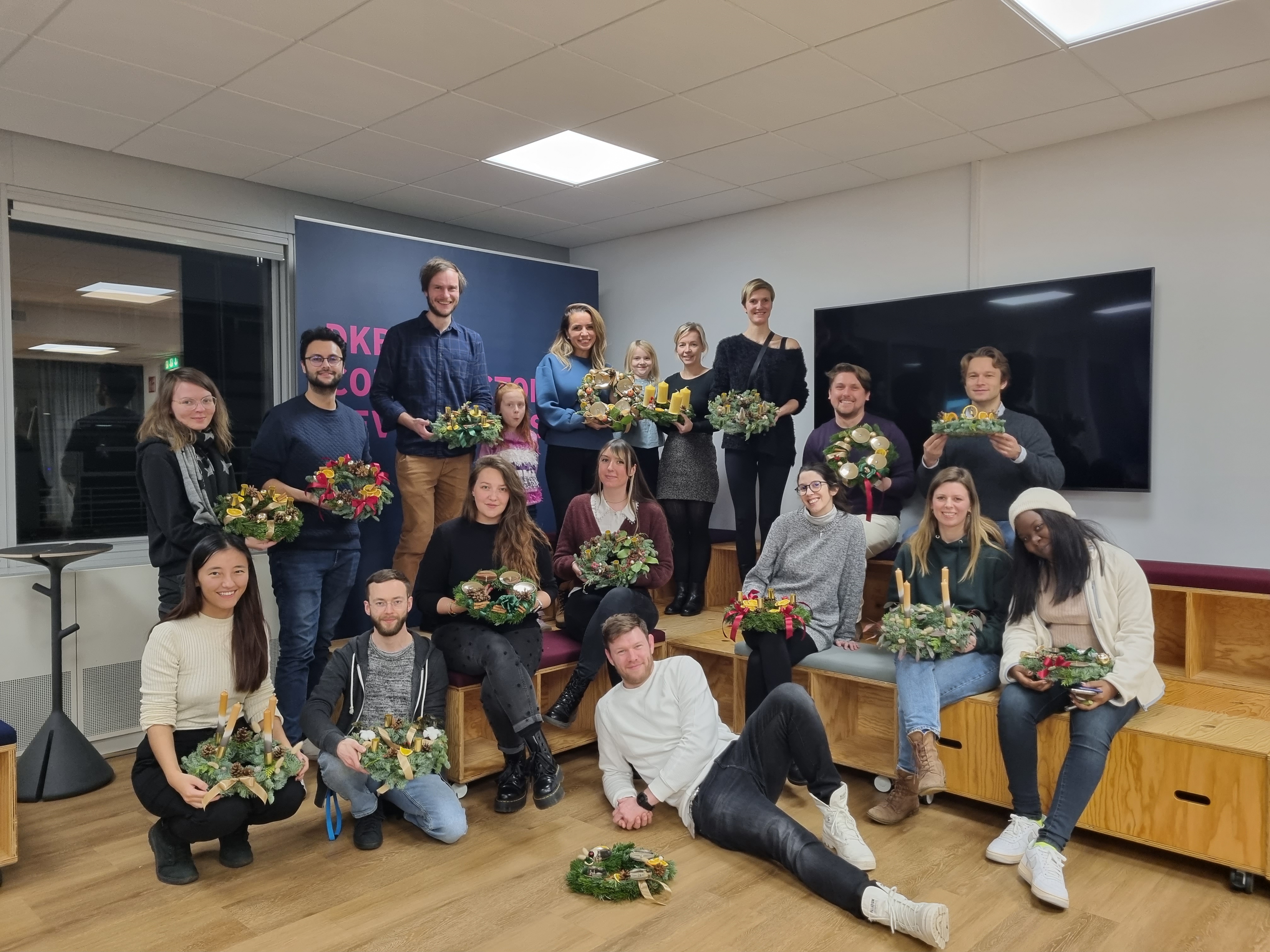 group picture of people after creating christmas decoration