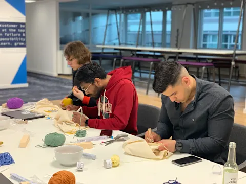 3 colleagues during the punch needle workshop