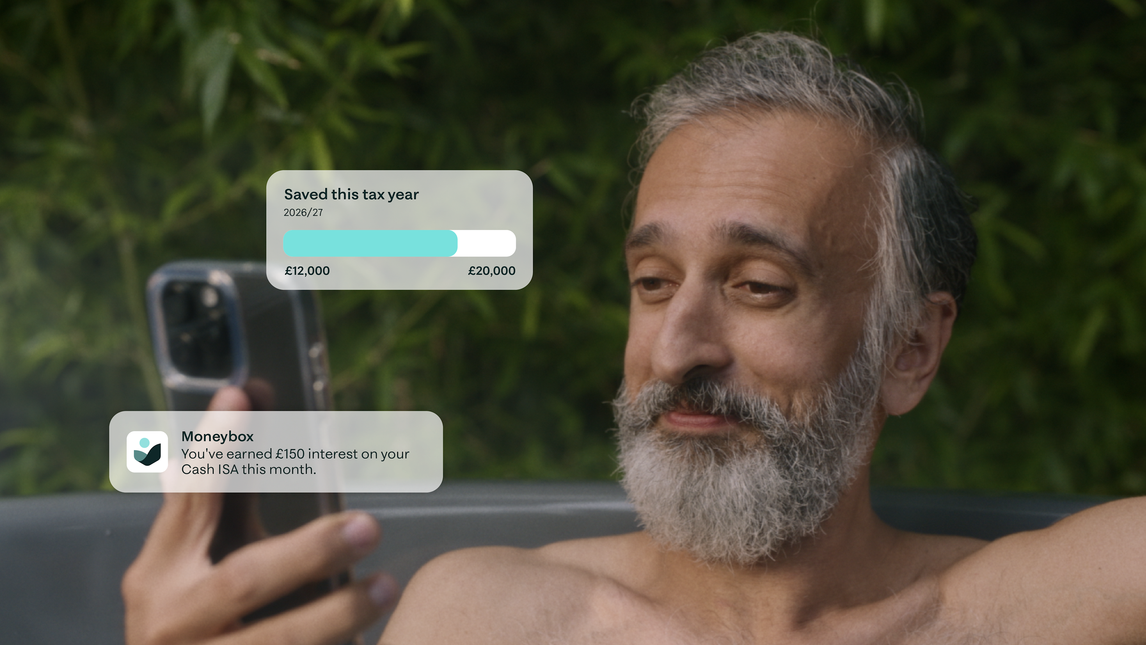 Photograph of a bearded man in hot tub looking at his phone, with app UI overlayed.
