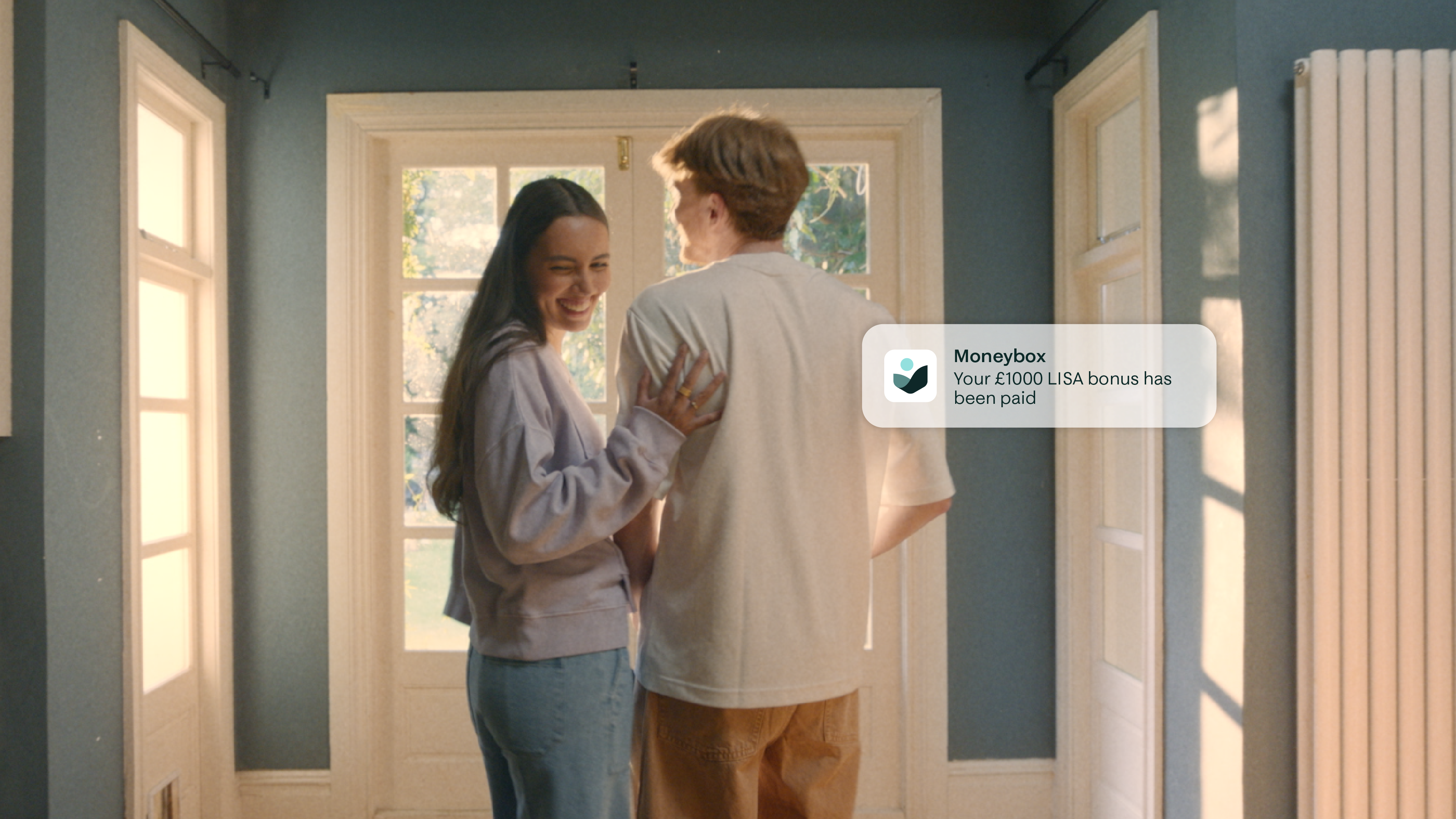 Couple walking in house with UI element over it