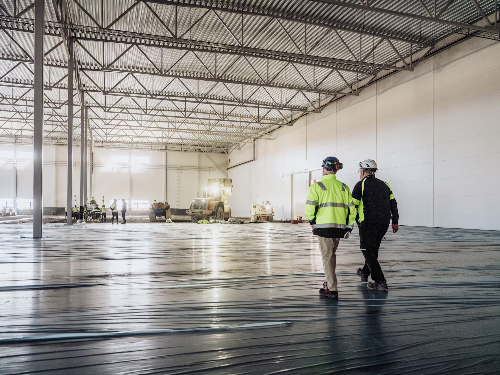 Persons walking in warehouse