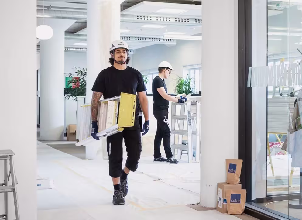 Installer carrying ladder