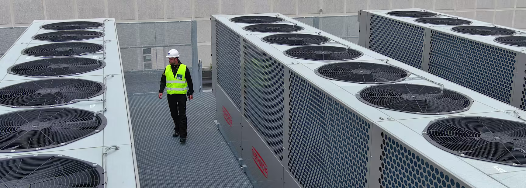 Man between Thermonova heat pumps
