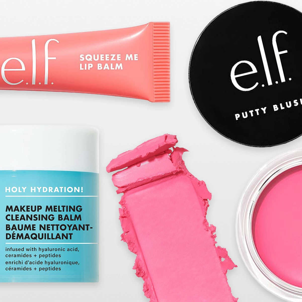 Produktbild med flera e.l.f.-produkter på ljus bakgrund: en tub med läppbalsam, en burk rengörande balm med blå etikett, en öppen burk med rosa krämprodukt, ett svart runt lock med e.l.f.-logotyp samt ett utstruket rosa krämprov i mitten.