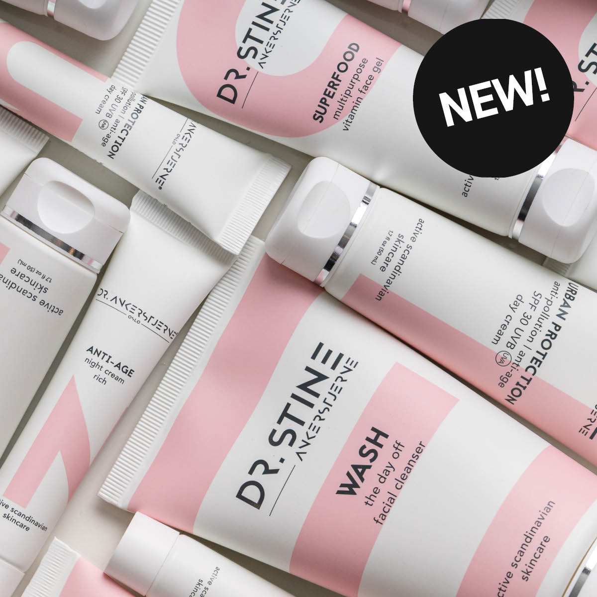 Useita DR. STINE -ihonhoitotuotteita vaalealla taustalla vaaleanpunaisissa ja valkoisissa pakkauksissa. Näkyvä teksti sisältää ”NEW!”, ”WASH the day off facial cleanser”, ”SUPERFOOD multipurpose vitamin face gel”, ”ANTI-AGE night cream rich”, ”URBAN PROTECTION anti-pollution | anti-age SPF 30 UVA UVB day cream” sekä ”active scandinavian skincare”.