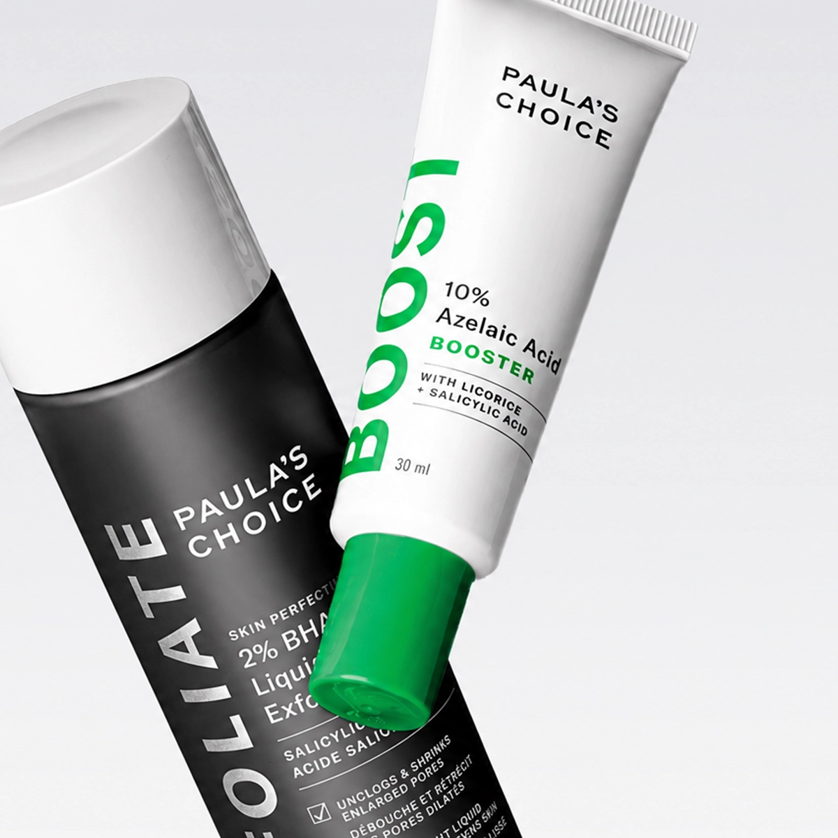 Kaksi Paula’s Choice -ihonhoitotuotetta vaaleaa taustaa vasten: Skin Perfecting 2% BHA Liquid Exfoliant ja 10% Azelaic Acid Booster, joiden pakkauksissa näkyvät tekstit “PAULA’S CHOICE”, “BOOST” ja “30 ml”. Tuotteet liittyvät kuorivaan ihonhoitoon salisyylihapon ja atselaiinihapon avulla.