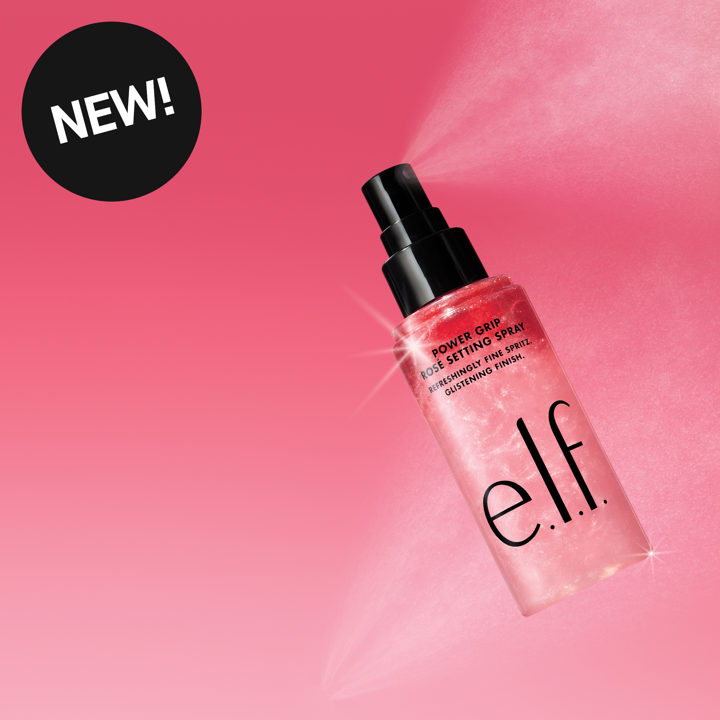 e.l.f. Power Grip Rose Setting Spray -kiinnityssuihke vaaleanpunaisella taustalla, suihke leviää pullosta. 