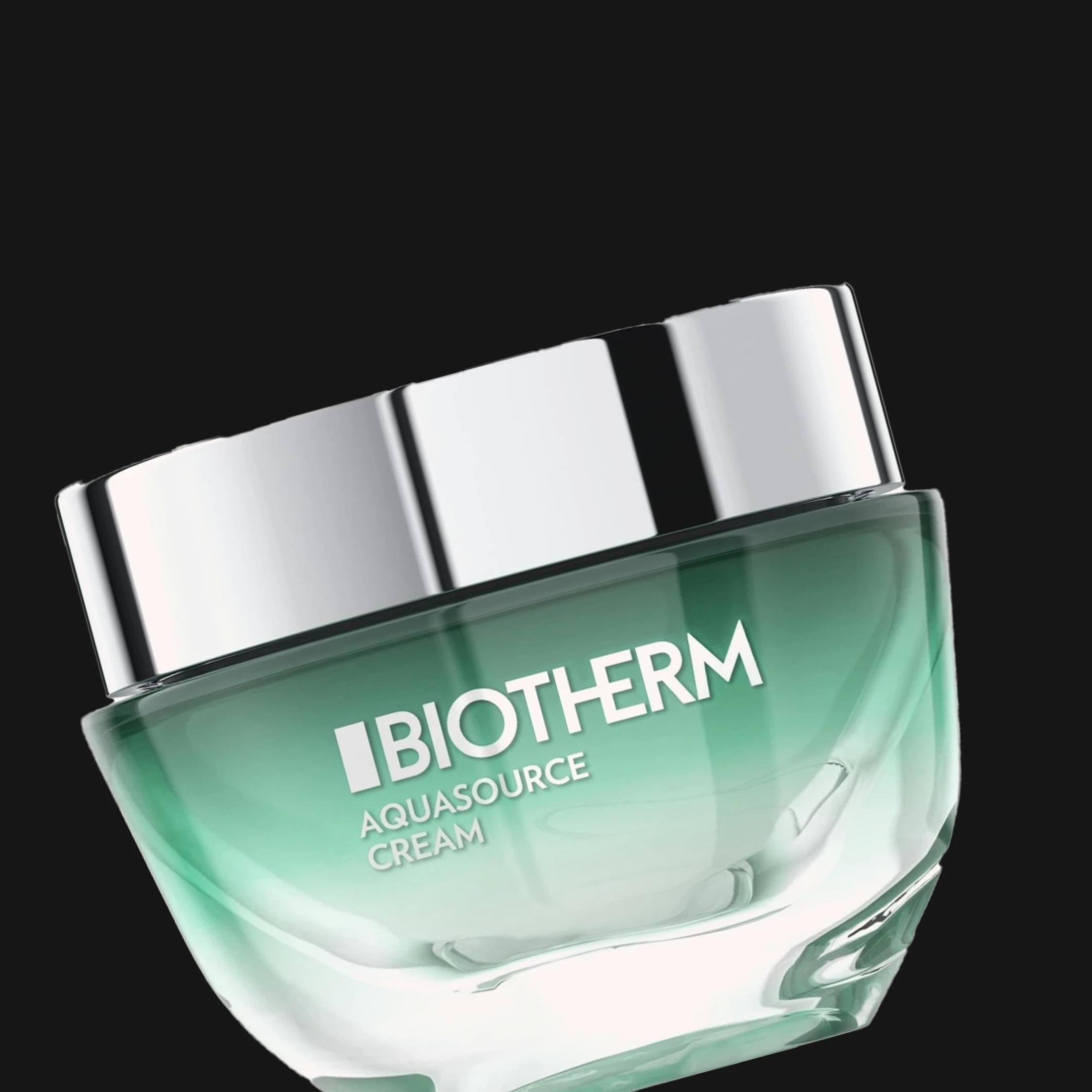 Grønn glasskrukke Biotherm Aquasource Cream med sølvfarget lokk mot svart bakgrunn, merkenavn og produktnavn trykket på krukken.