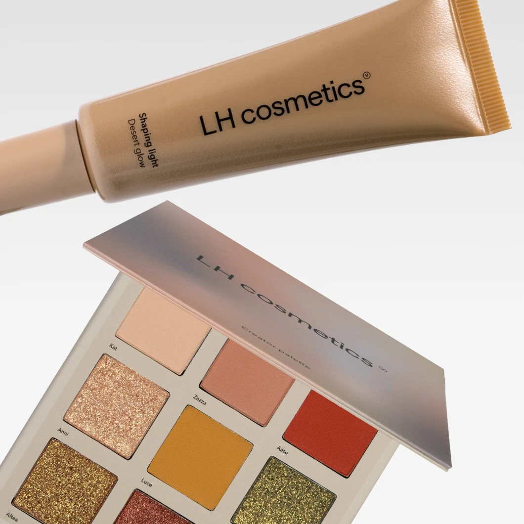 Bilde som viser to LH Cosmetics produkter: en beige tube med LH Cosmetics Shaping Light Desert Glow og en øyenskyggepalett med flere farger. Bakgrunnen er hvit.