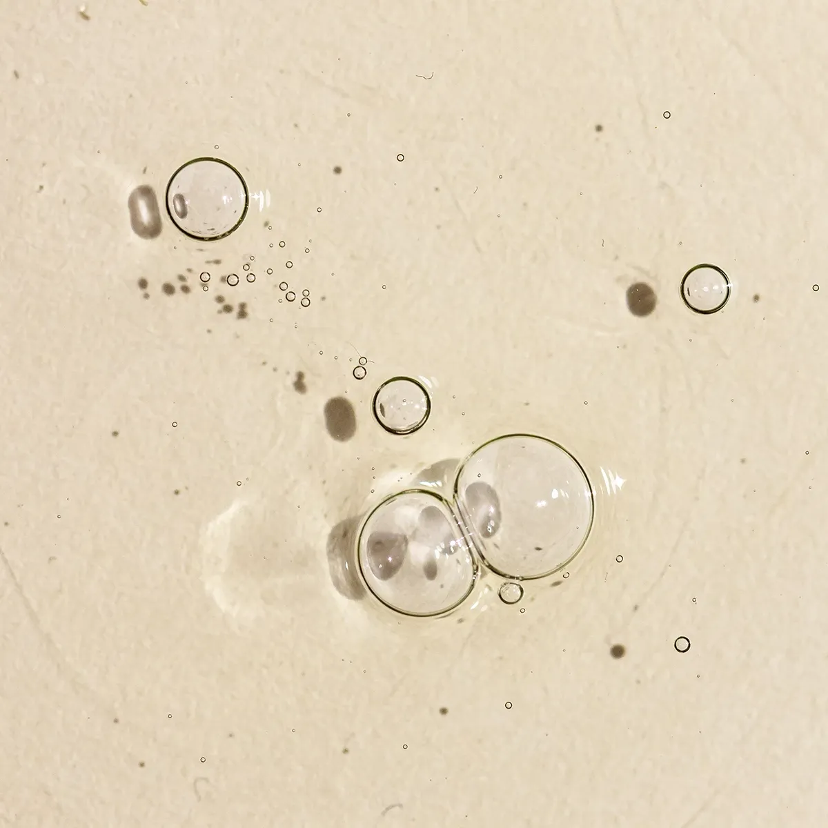 Texturbild på flytande vätska med bubblor i