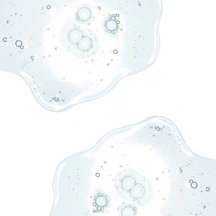 Närbild på genomskinlig gel- eller serumtextur med små bubblor
