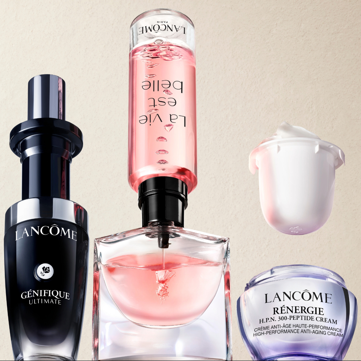 Lancôme-hudpleieprodukter mot lys bakgrunn: Génifique Ultimate-serum, La Vie Est Belle-flaske snudd opp ned under påfylling, samt Rénergie H.P.N. 300-Peptide-krem og refillkapsel.