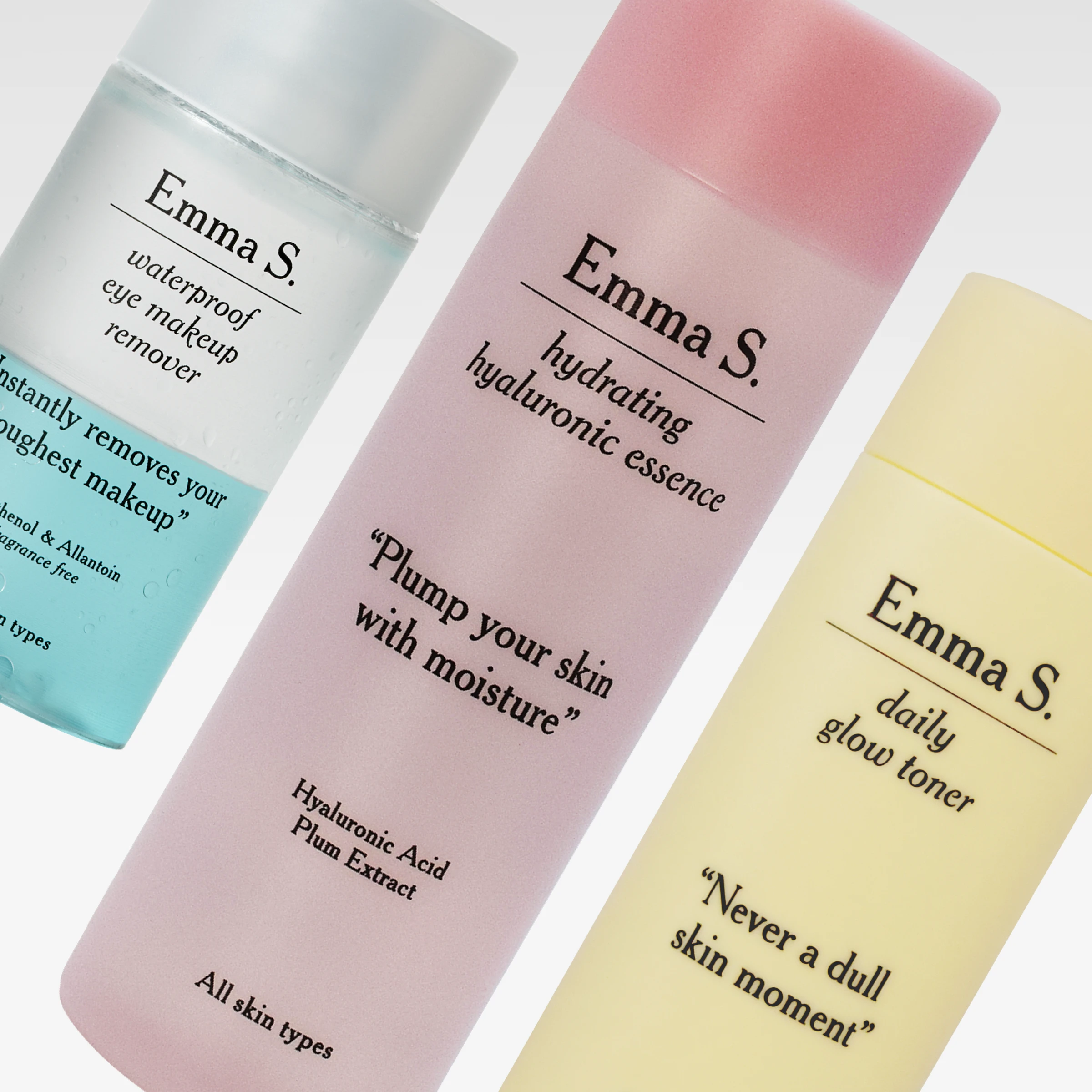 Emma S. -ihonhoitotuotteet pastellinvärisissä pulloissa, mukana waterproof eye makeup remover, hydrating hyaluronic essence ja daily glow toner valkoista taustaa vasten. Näkyvä teksti sisältää “Plump your skin with moisture”, “Never a dull skin moment” ja “All skin types”.
