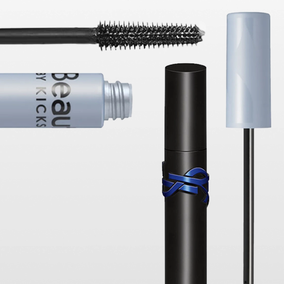 Useita ripsivärejä ja harjoja merkeiltä KICKS Beauty ja Nilens Jord, pakkauksissa tekstit "Beauty by KICKS" ja "NILENS JORD", mukana mustaa ripsivärimassaa ja avoimia pakkauksia vaalealla taustalla.