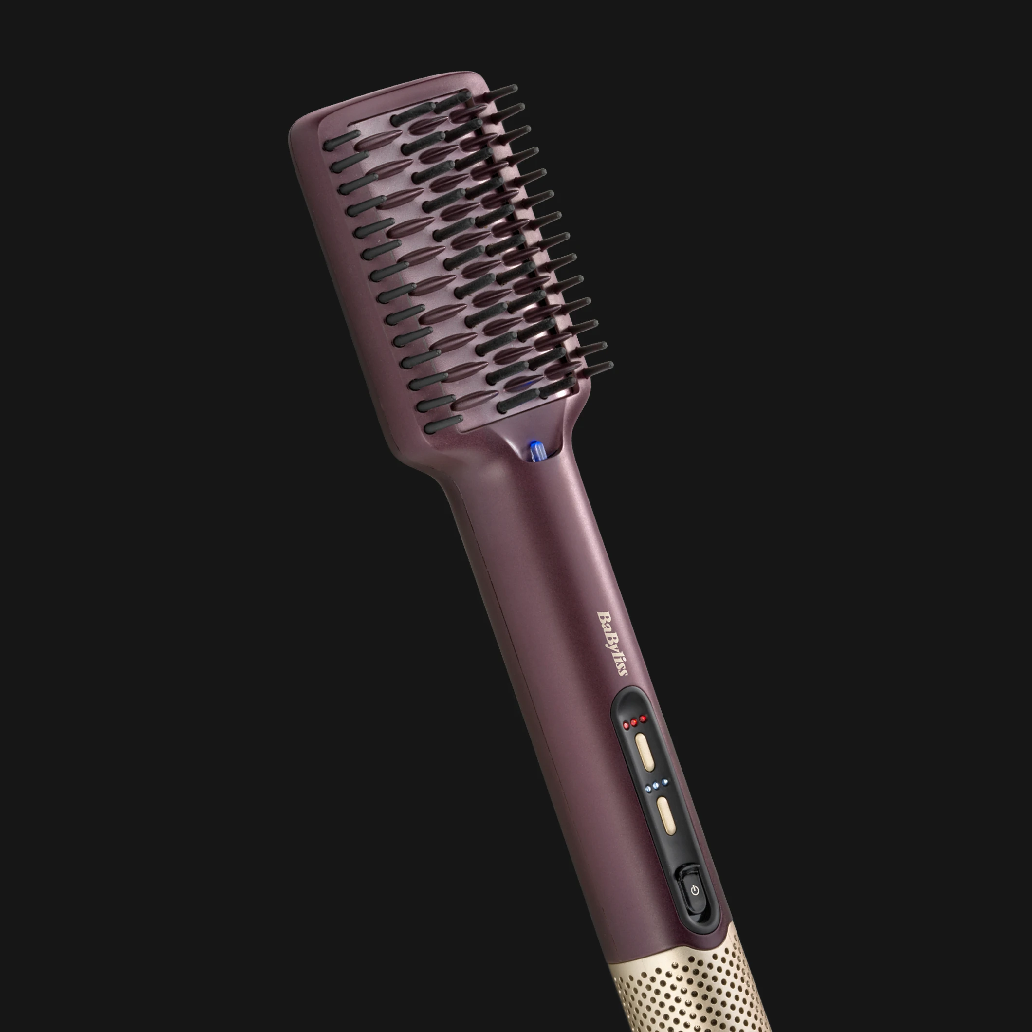 Varmebørste for hårstyling fra BaByliss i mørklilla design med bred padlebørste, børstepigger og kontrollknapper på håndtaket.