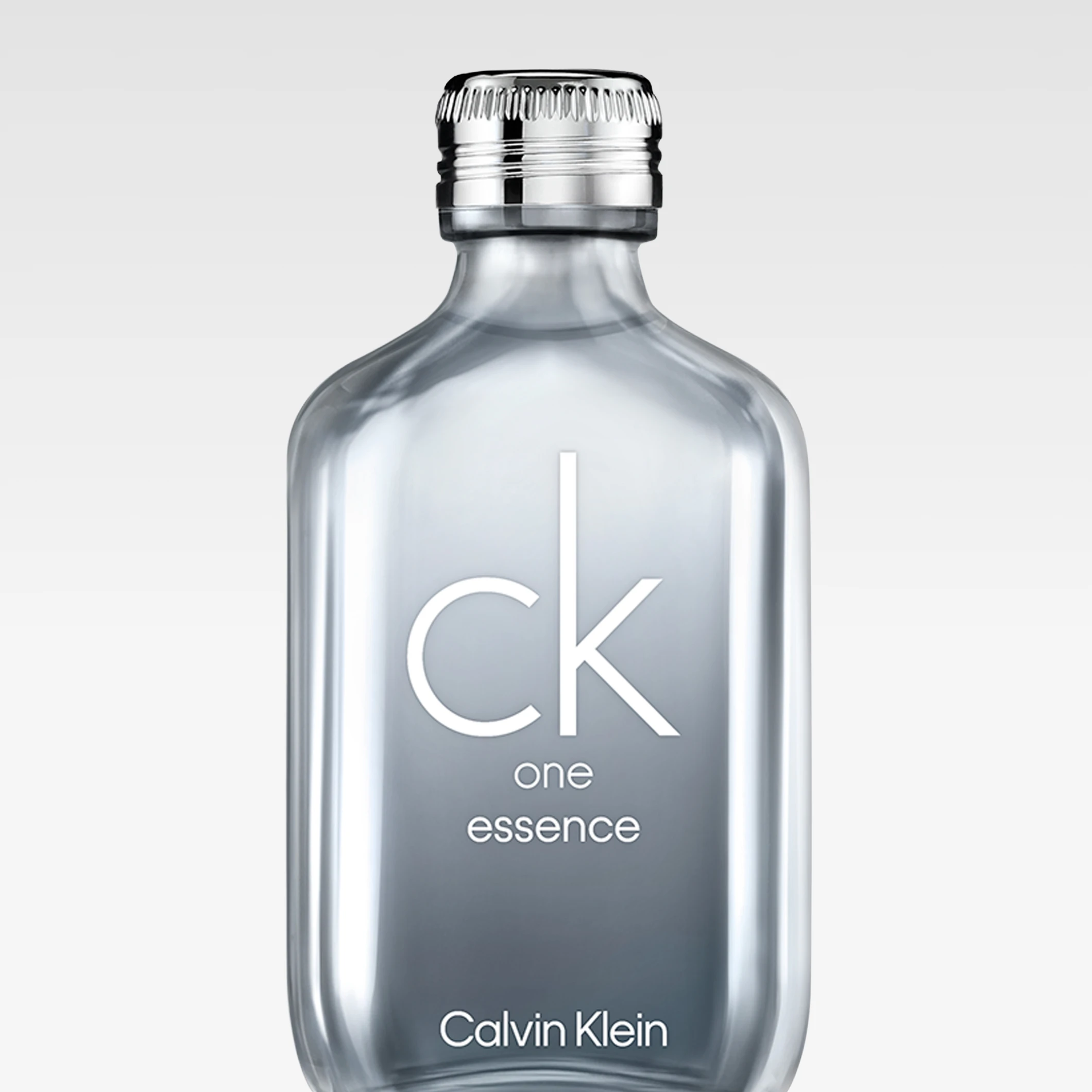 Flaske med Calvin Klein CK One Essence parfyme i transparent grå design med teksten “ck one essence Calvin Klein” på flasken.