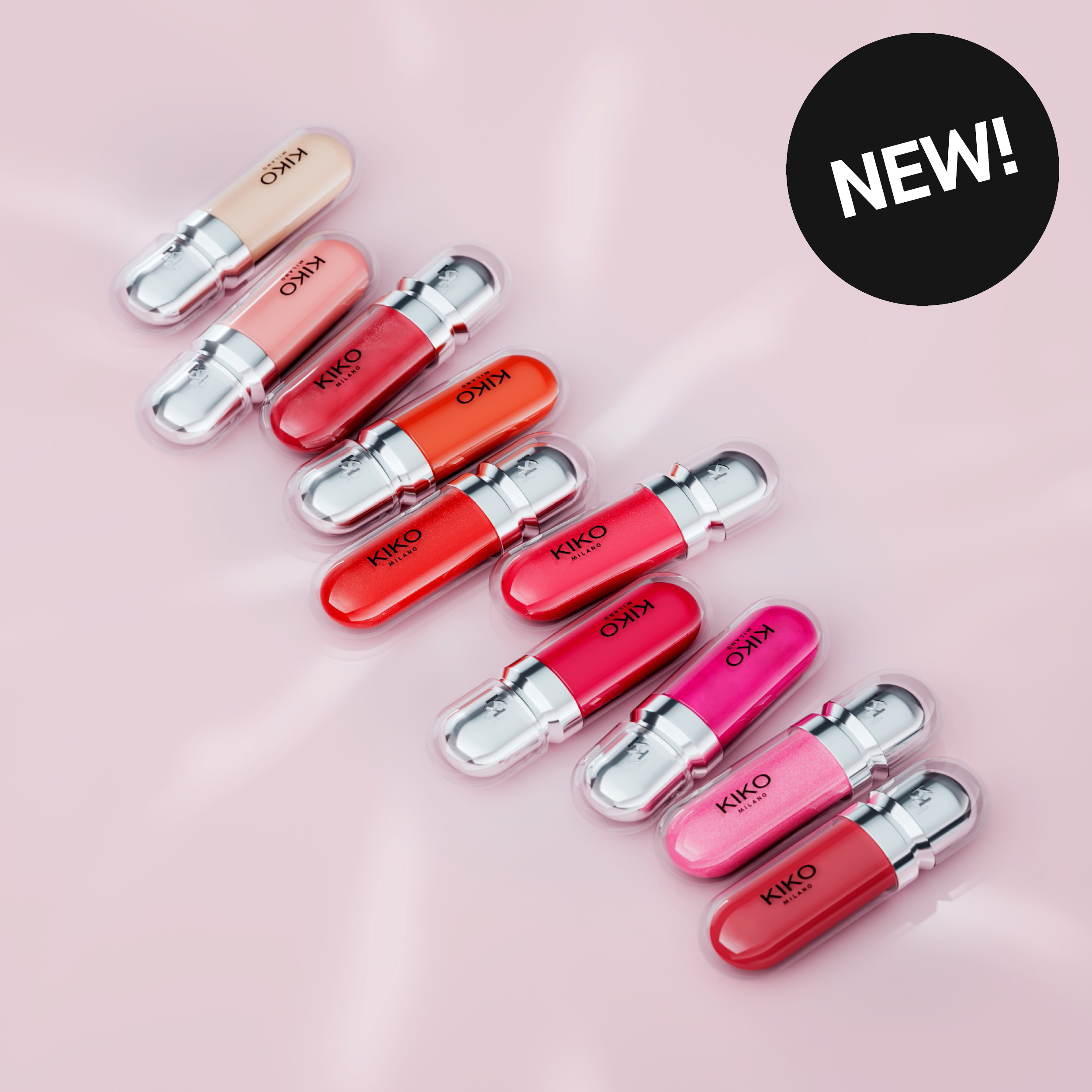 Läpprodukter från KIKO Milano i flera olika nyanser mot rosa bakgrund. Text: ”NEW!”