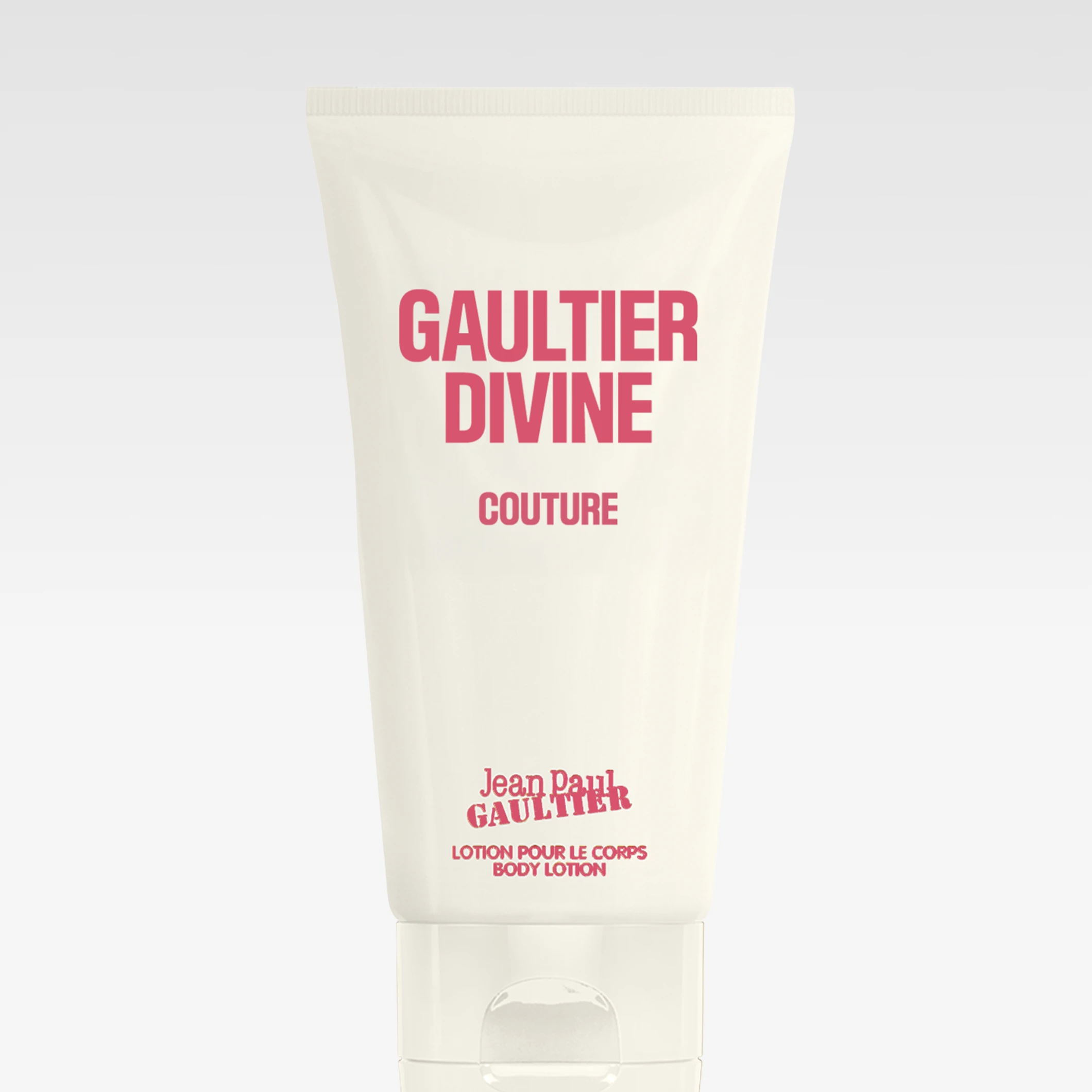 Jean Paul Gaultier Divine Couture body lotion i beige tube med rosa teksten “GAULTIER DIVINE COUTURE” og “Jean Paul Gaultier Lotion pour le corps Body Lotion”.