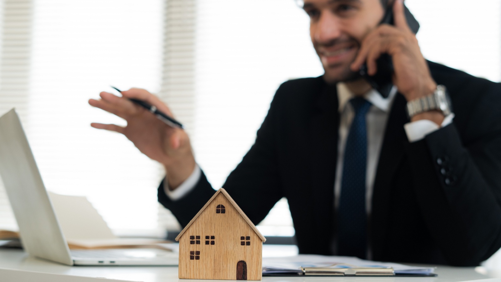 Estate agent talking on phone