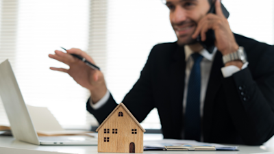 Estate agent talking on phone